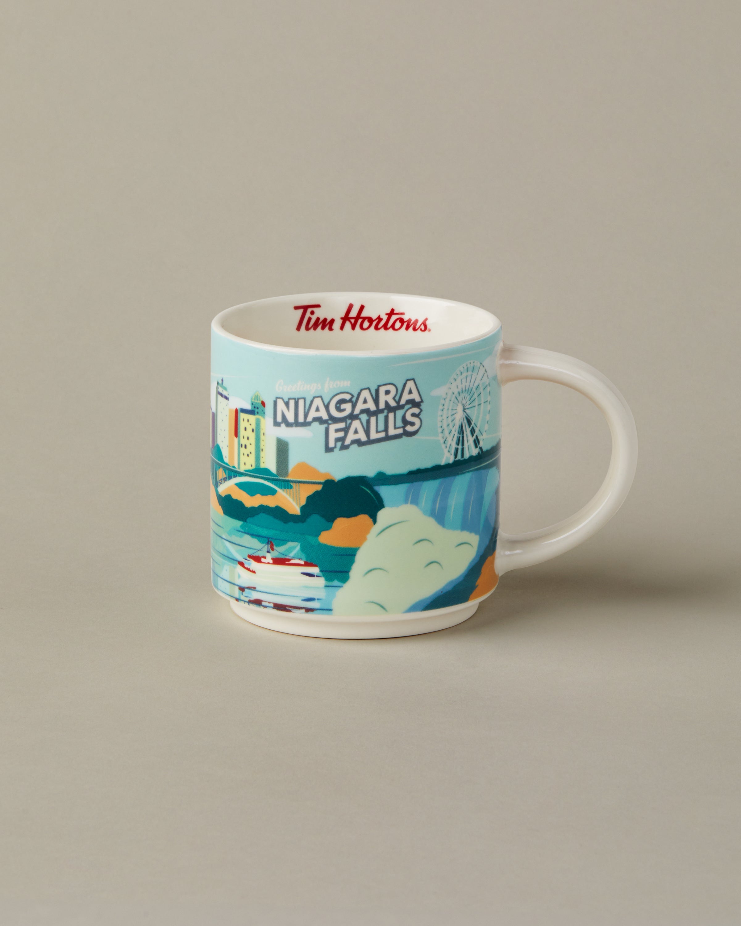 16oz ceramic Tim Hortons mug with Niagara Falls skyline design | Tasse Tim Hortons de 16 oz représentant l’horizon de Niagara Falls. - Image #1