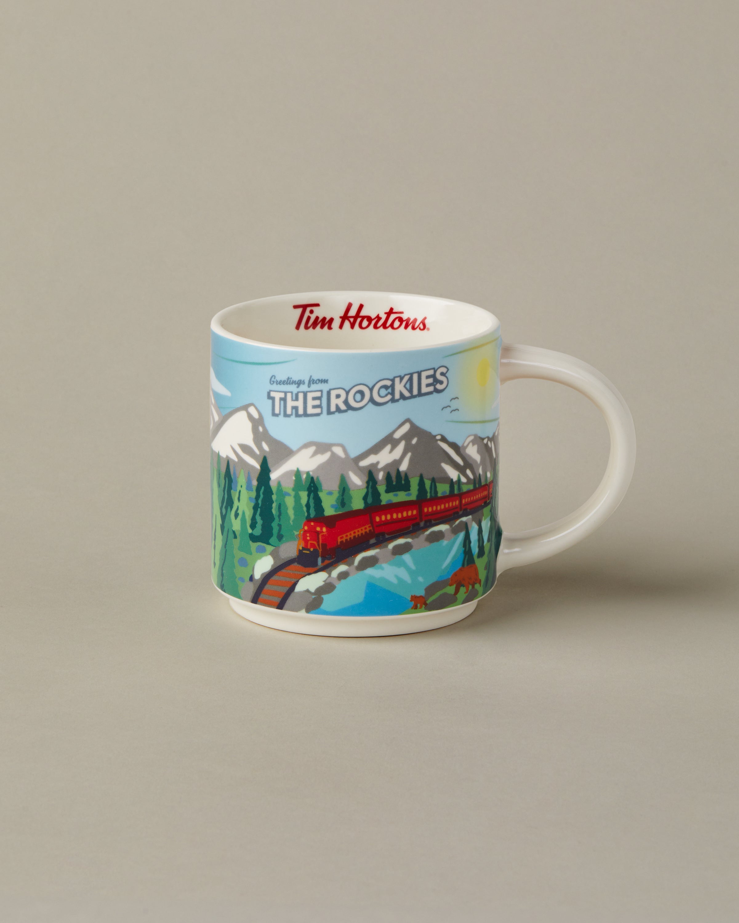 16oz ceramic Tim Hortons mug with The Rockies landscape design | Tasse Tim Hortons de 16 oz représentant des paysages des Rocheuses. - Image #1