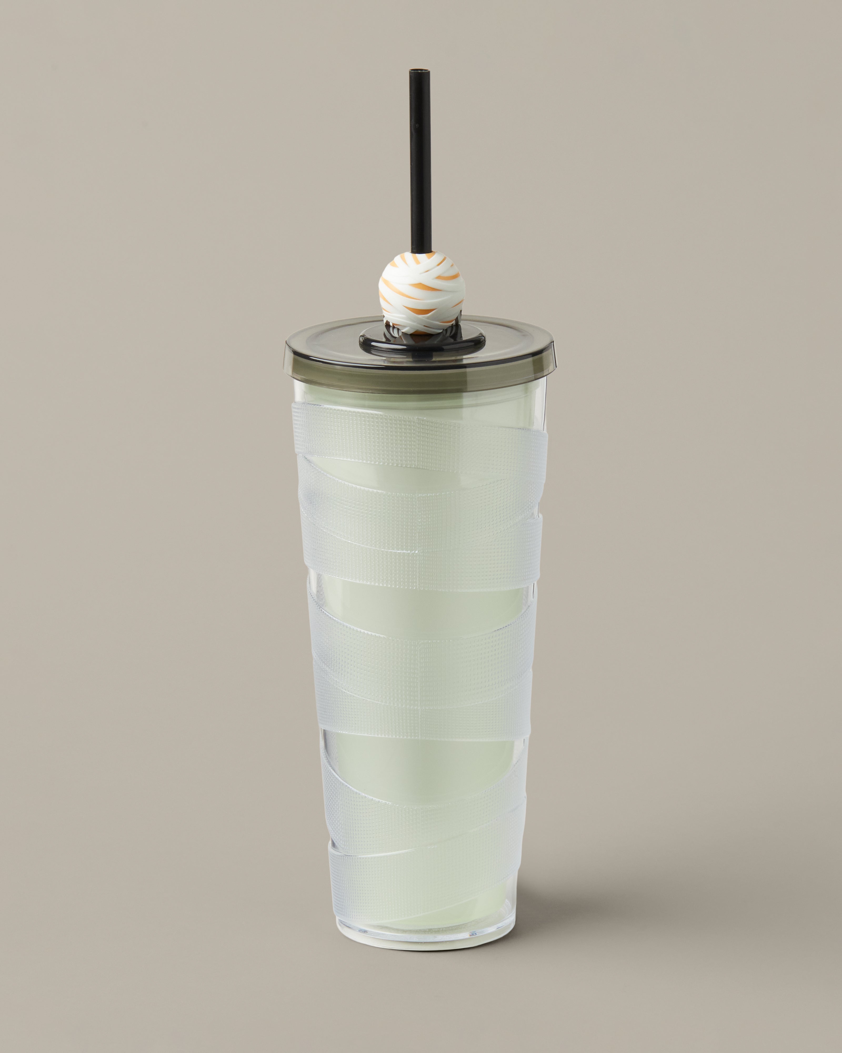 Green and purple 24oz plastic straw tumbler with a glow-in-the-dark Timbits® Mummy topper. | Gobelet en plastique vert et mauve de 24 oz avec paille, avec décoration momie TimbitsMD phosphorescente. - Image #3