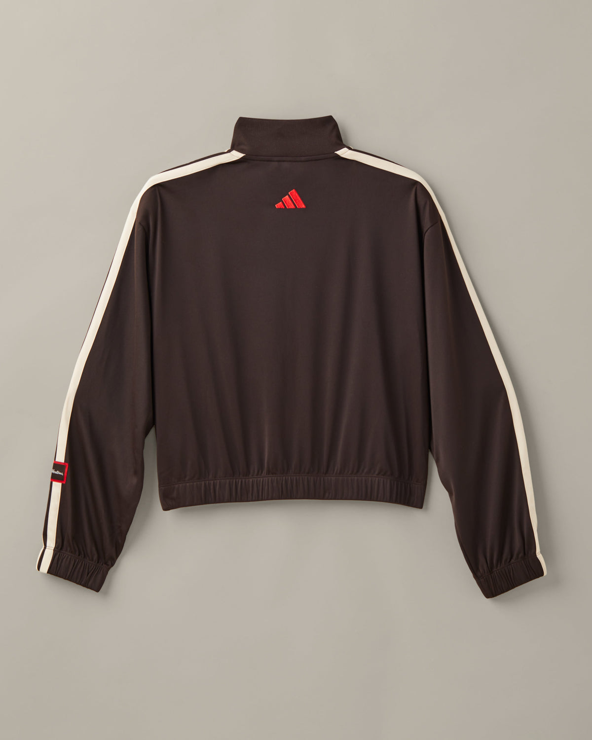 Women’s cropped espresso-brown adidas® track top with a cream zipper, cream 3-Stripes, and a Tims Run Club chest graphic. - Image #3