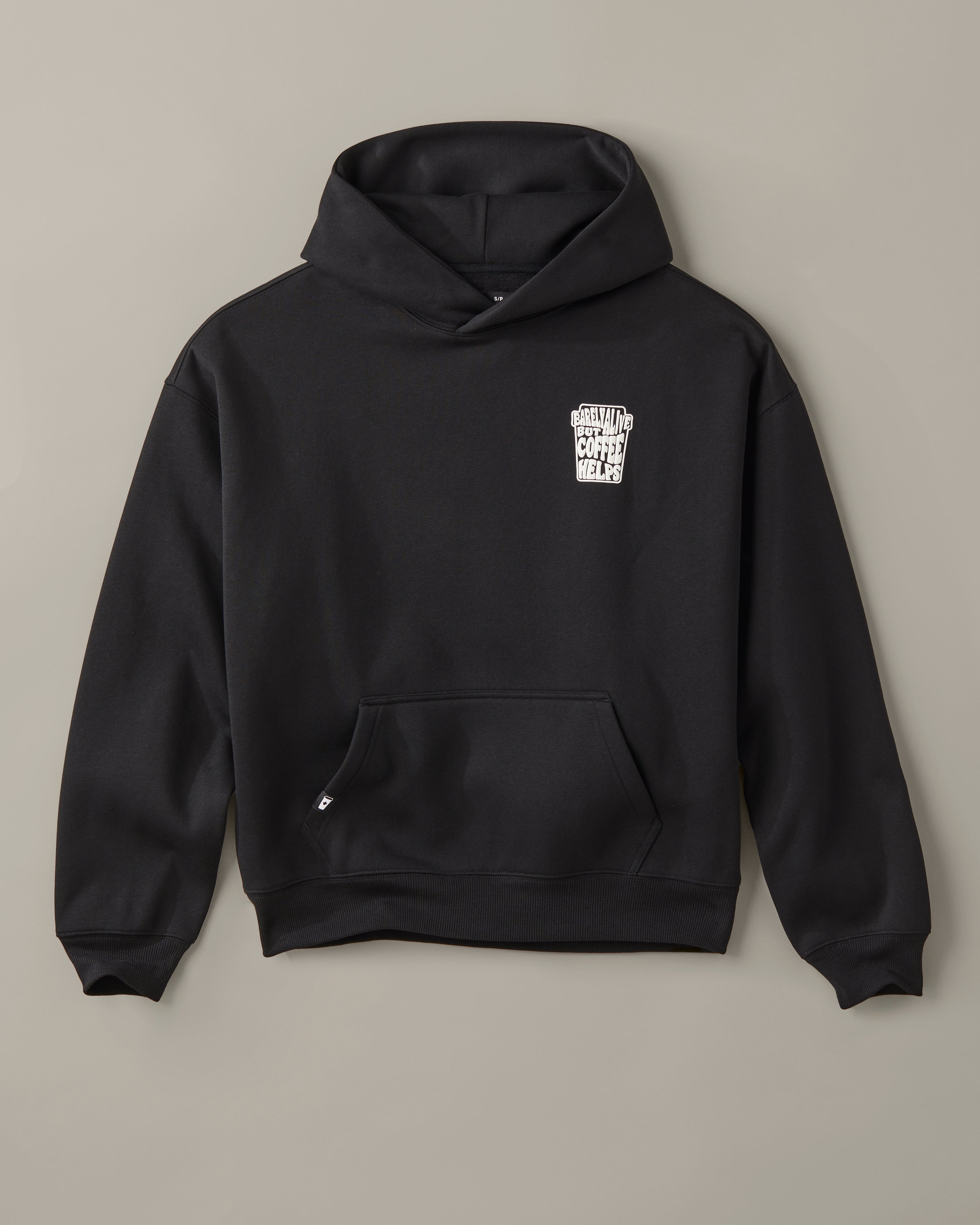 Black unisex pullover hoodie with a small white Barely Alive graphic on the chest. | Chandail à capuchon unisexe noir avec design « Barely Alive » sur le torse. - Image #4