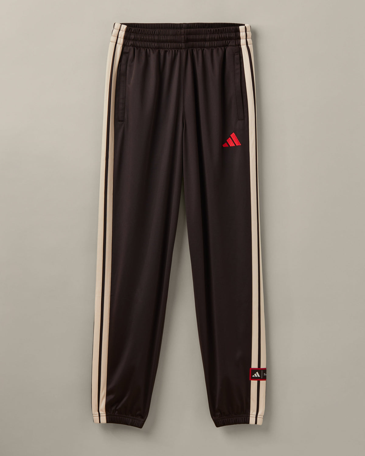 Men’s espresso-brown adidas® track pants with cream 3-Stripes and adidas® x Tim Hortons collaboration details. - Image #2