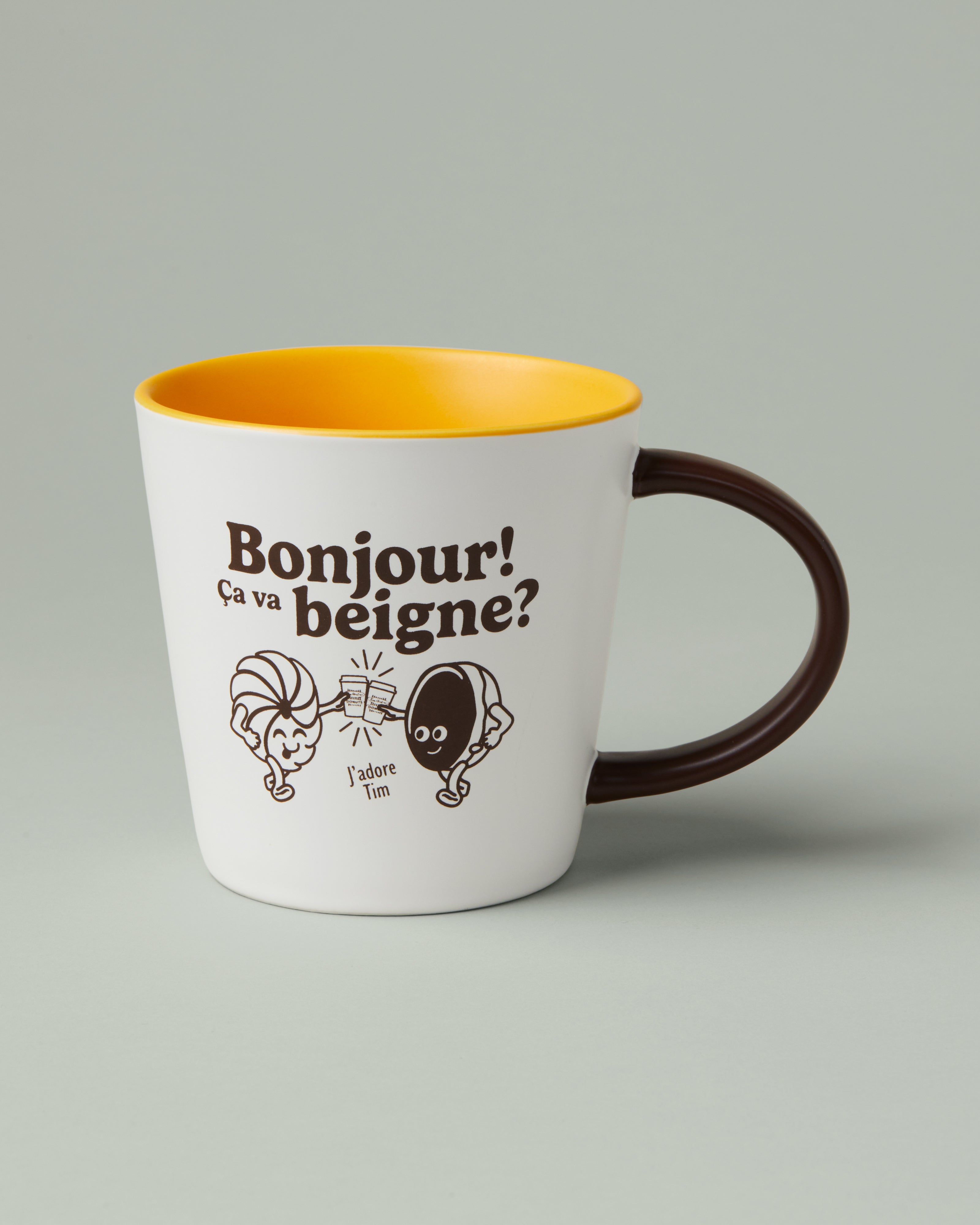 16oz retro ceramic mug with “Bonjour Ça va beigne” phrase and Tim Hortons branding | Tasse de porcelaine rétro de 16 oz avec phrase « Bonjour! Ça va beigne? » et marque Tim Hortons. - Image #1