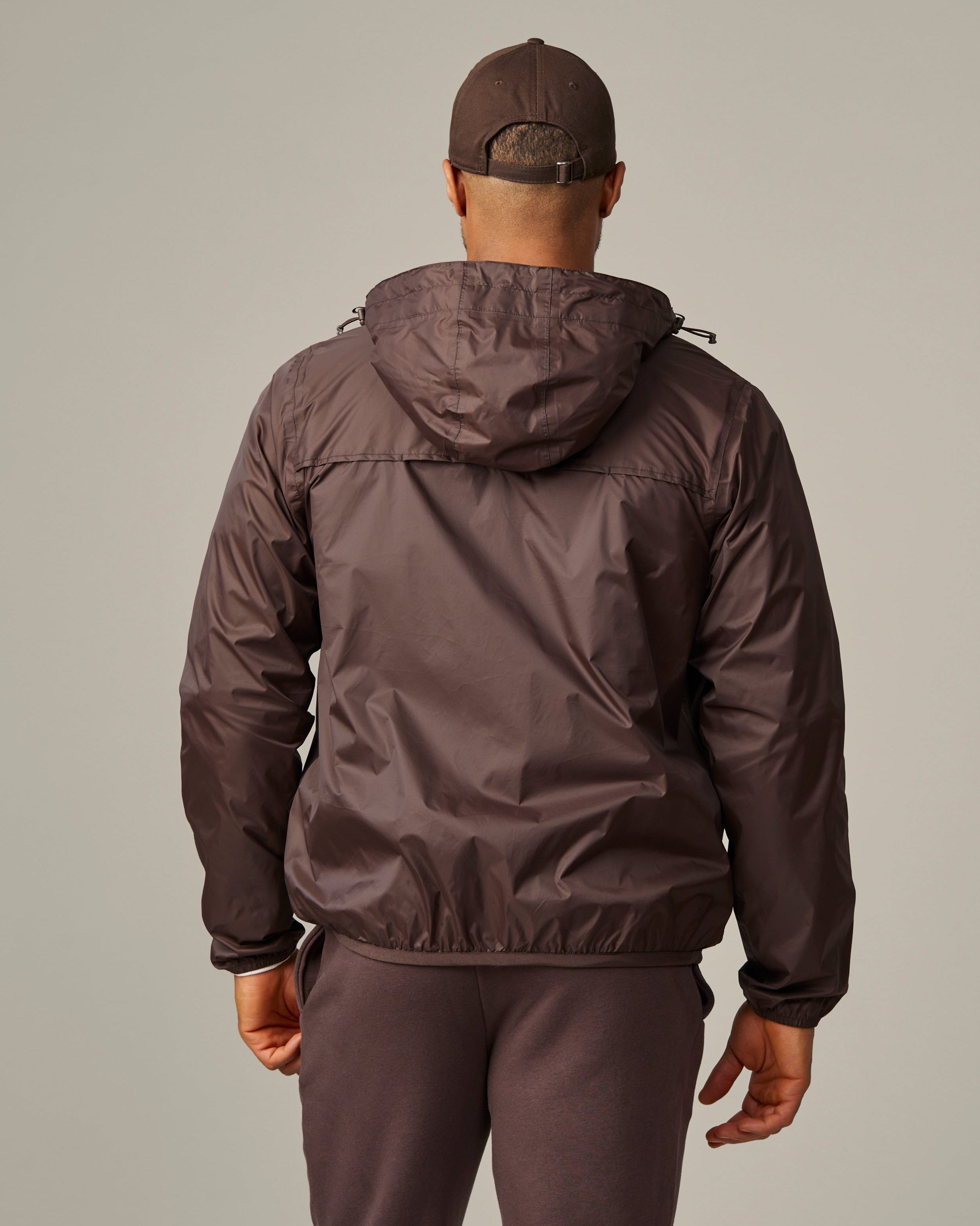 Espresso-coloured unisex packable jacket featuring retro Tim Hortons logo | Veste compressible unisexe espresso avec logo Tim Hortons rétro. - Image #4