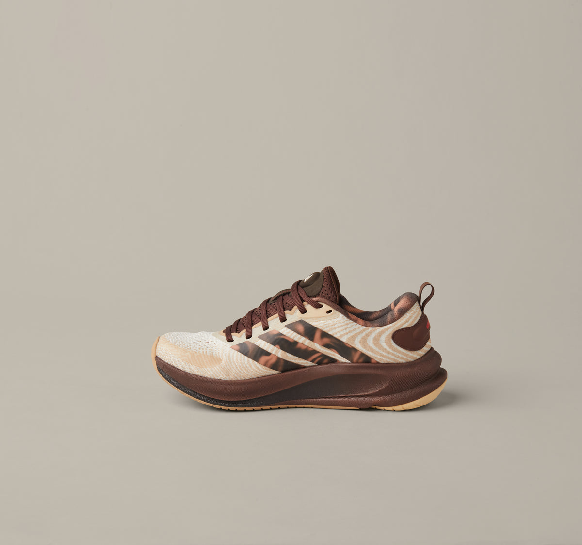 Women’s adidas® Supernova Ease running shoes in cream and coffee-brown shades with patterned 3-Stripes and Tim Hortons details. - Image #2