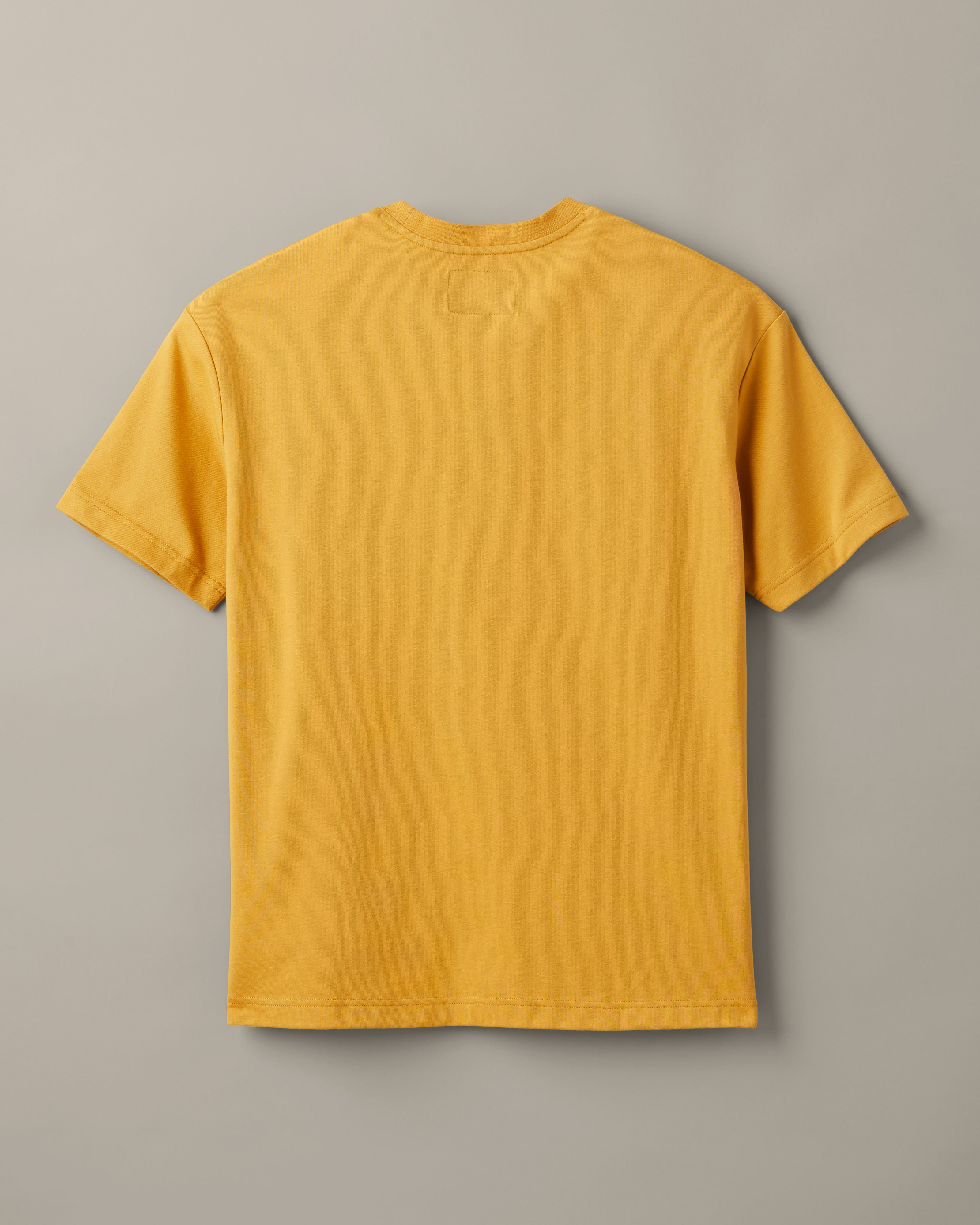 Ochre Tim Hortons crew-neck T-shirt with a small Pick Up Some Tims crane and coffee cup graphic on the chest. | T-shirt Tim Hortons ocre à encolure ronde avec une petite illustration de grue et de gobelet de café « Prendre son Tim » sur la poitrine. - Image #4