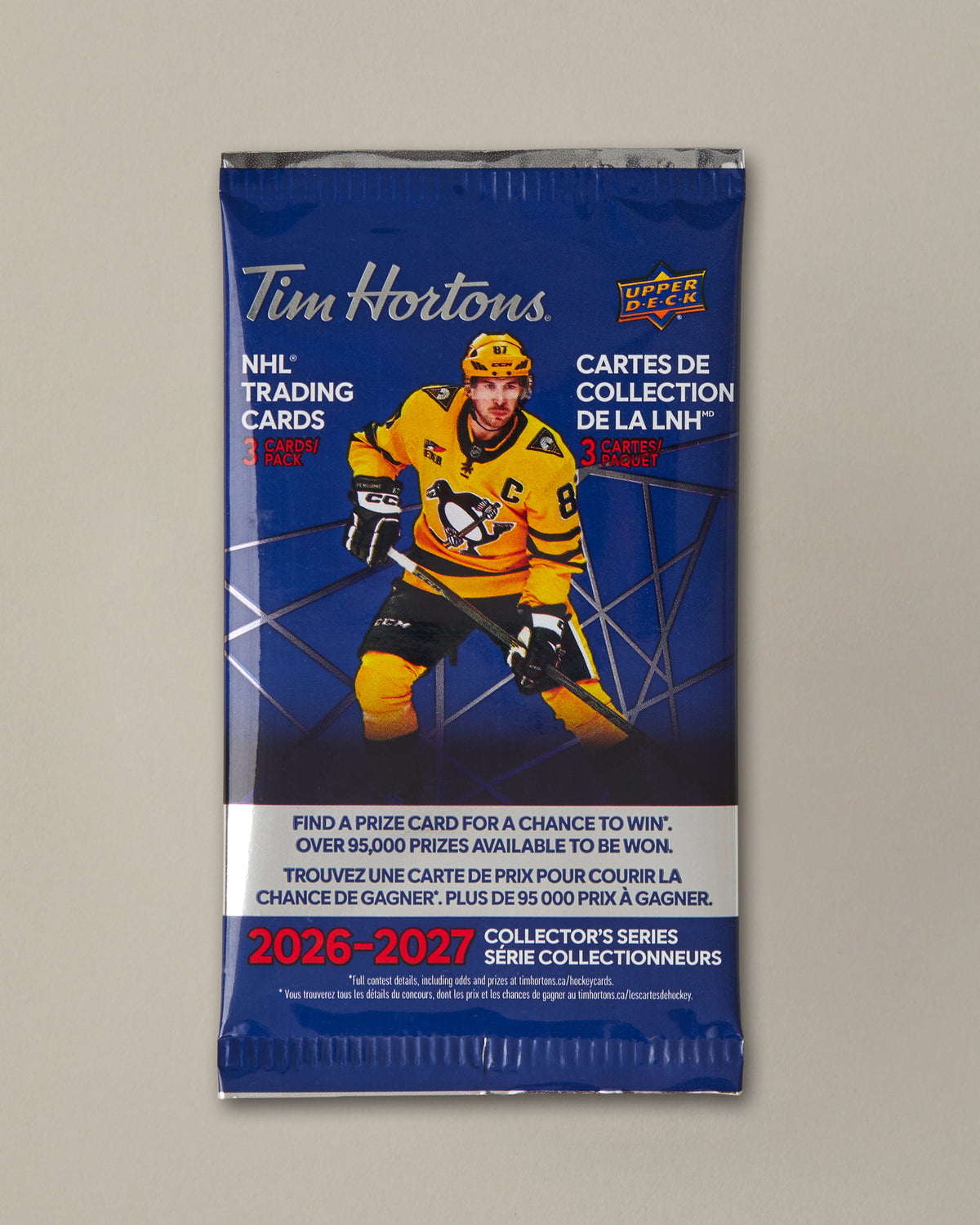 A Tim Hortons NHL trading cards collector's series pack featuring a blue background with a hockey player graphic and text for 2026-2027. - Image #1