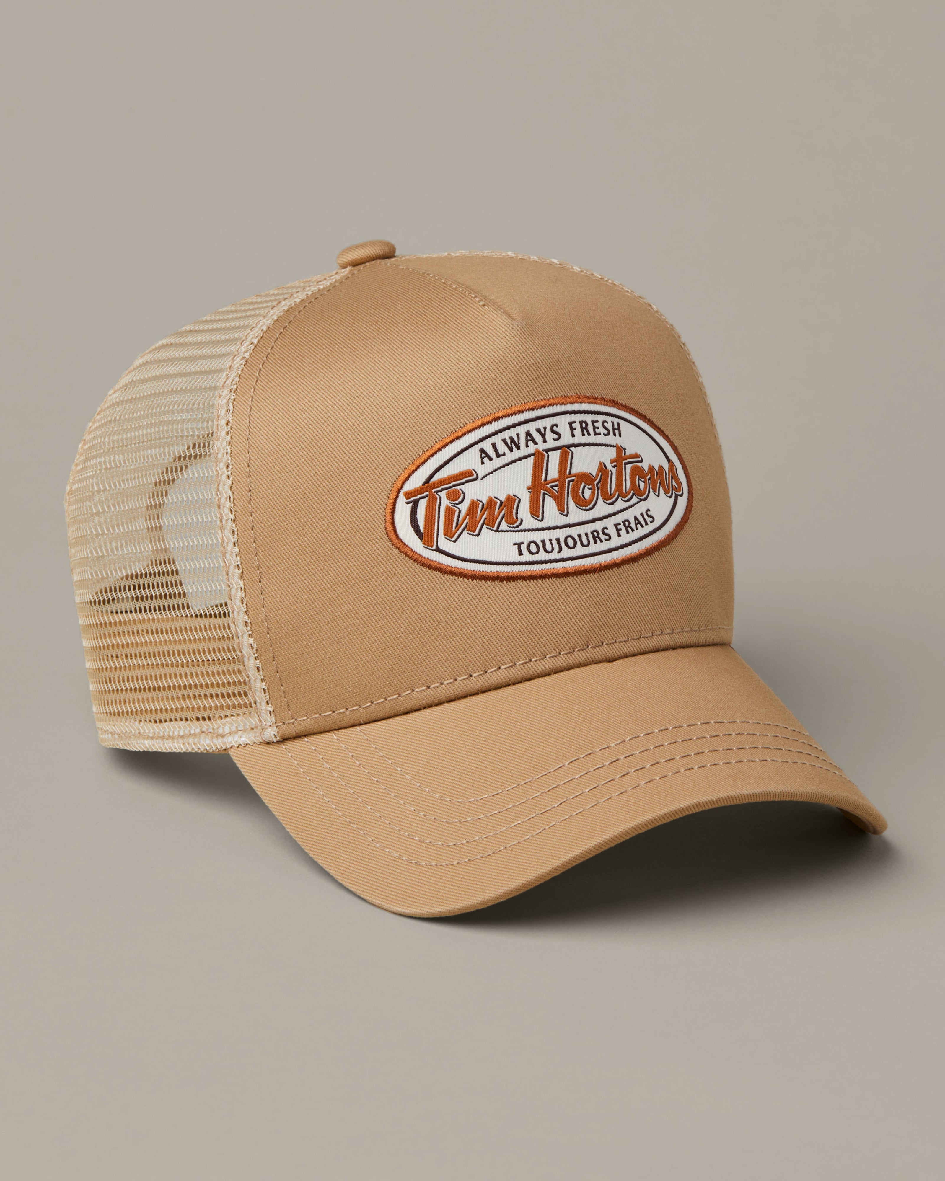 Tan Tim Hortons trucker hat with cream mesh back and retro Always Fresh bilingual logo patch. | Casquette de camionneur Tim Hortons beige avec dos en filet crème et écusson rétro bilingue Toujours frais. - Image #2