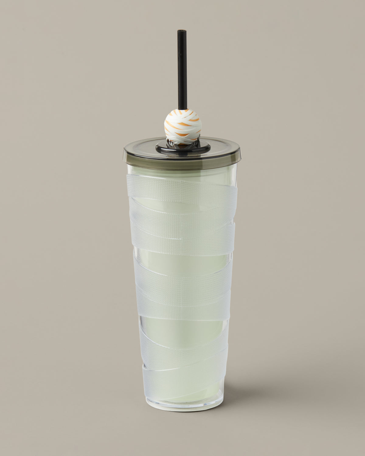 Green and purple 24oz plastic straw tumbler with a glow-in-the-dark Timbits® Mummy topper. | Gobelet en plastique vert et mauve de 24 oz avec paille, avec décoration momie TimbitsMD phosphorescente. - Image #3