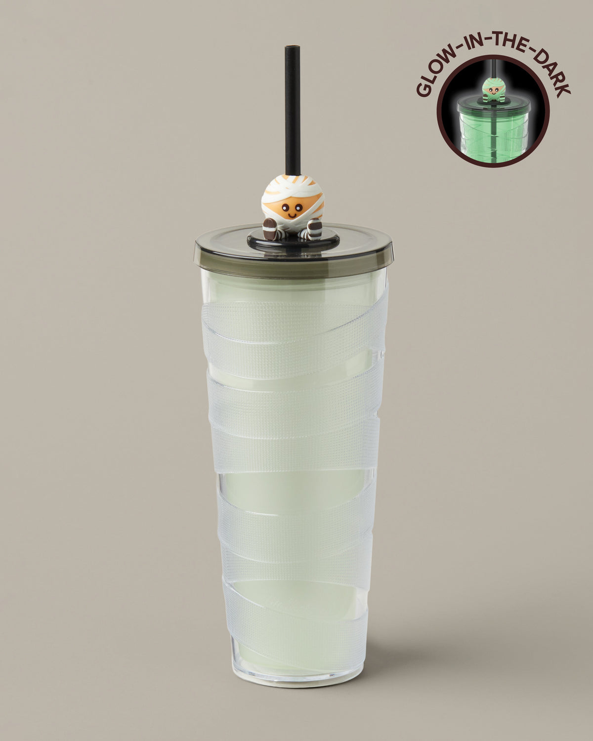 Green and purple 24oz plastic straw tumbler with a glow-in-the-dark Timbits® Mummy topper. | Gobelet en plastique vert et mauve de 24 oz avec paille, avec décoration momie TimbitsMD phosphorescente. - Image #1