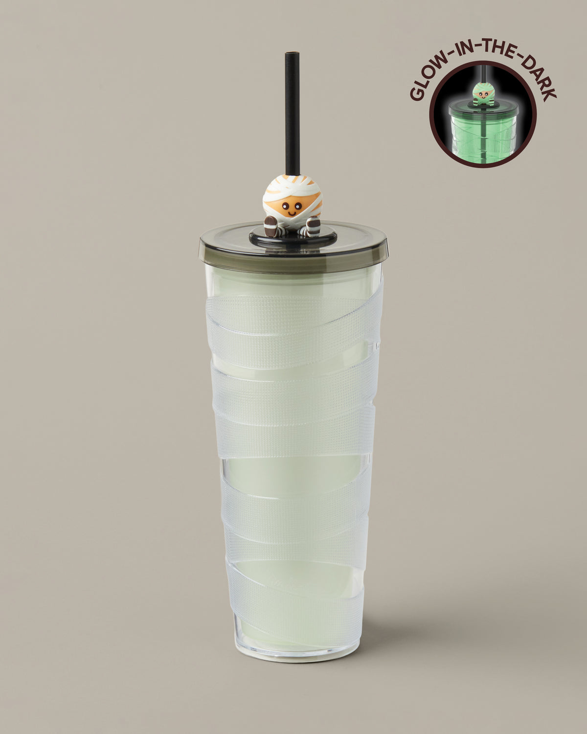 Green and purple 24oz plastic straw tumbler with a glow-in-the-dark Timbits® Mummy topper. | Gobelet en plastique vert et mauve de 24 oz avec paille, avec décoration momie TimbitsMD phosphorescente. - Image #1