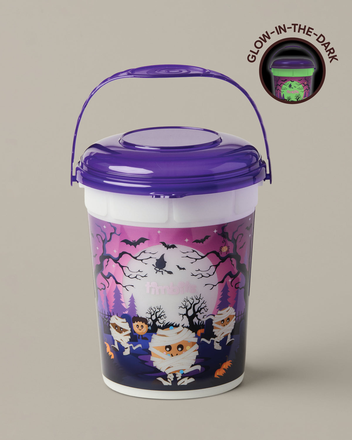 Purple-and-white Timbits® Mummy Halloween bucket shown with a lid and handle | Seau d’Halloween momie TimbitsMD mauve et blanc, présenté avec couvercle et poignée. - Image #1