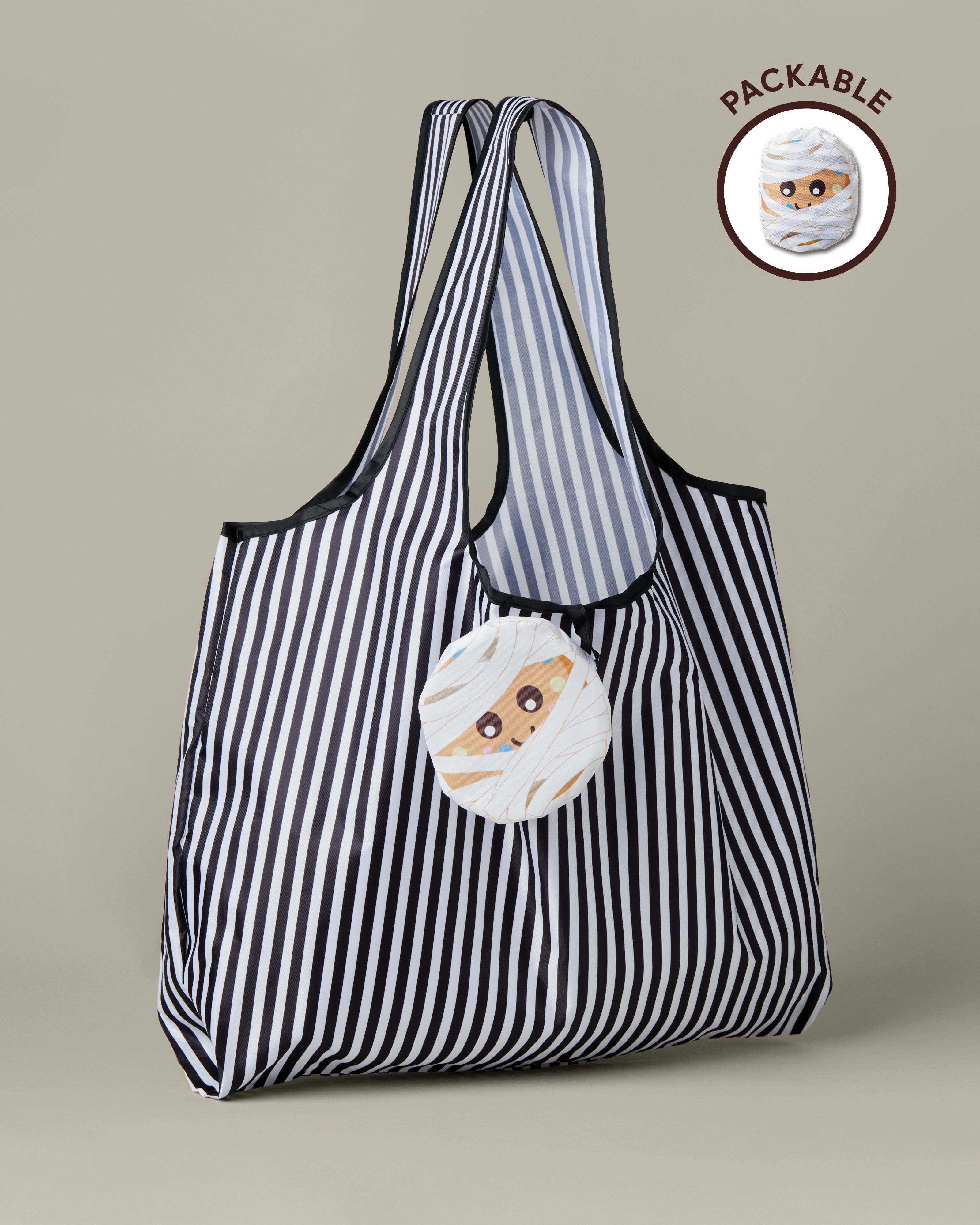 Black-and-white striped packable tote bag with a Timbits® Mummy storage pouch. | Sac réutilisable repliable rayé noir et blanc avec poche de rangement momie TimbitsMD. - Image #1