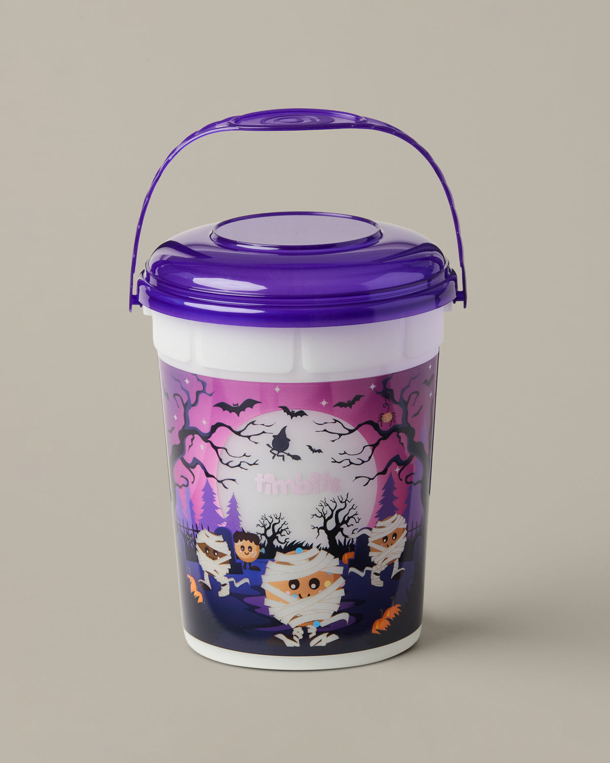 Purple-and-white Timbits® Mummy Halloween bucket shown with a lid and handle | Seau d’Halloween momie TimbitsMD mauve et blanc, présenté avec couvercle et poignée. - Image #3