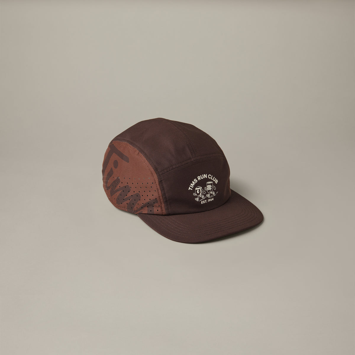 Espresso-brown adidas® trainer hat with perforated side panels and a cream Tims Run Club graphic on the front. - Image #1