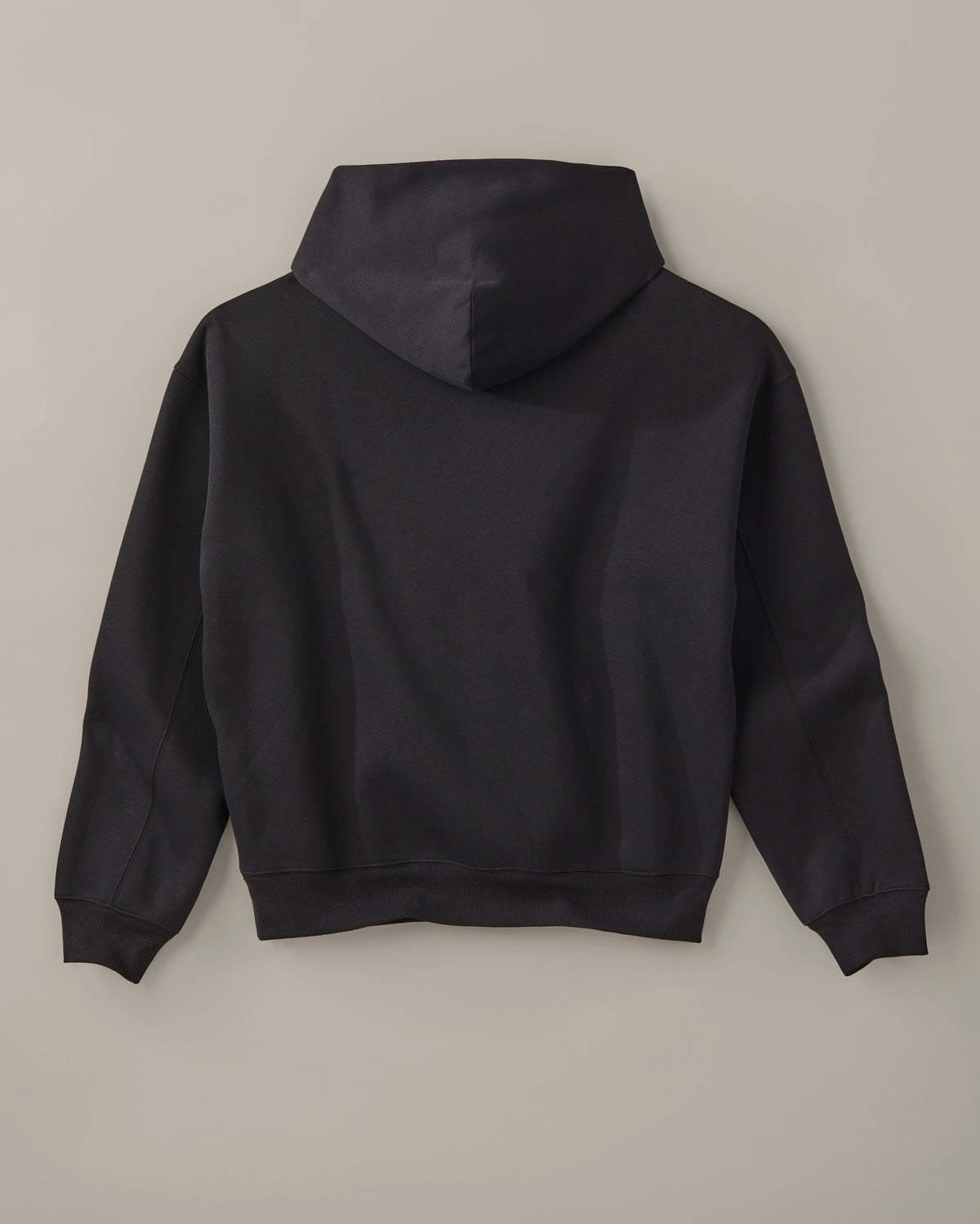 Black unisex pullover hoodie with a small white Barely Alive graphic on the chest. | Chandail à capuchon unisexe noir avec design « Barely Alive » sur le torse. - Image #5