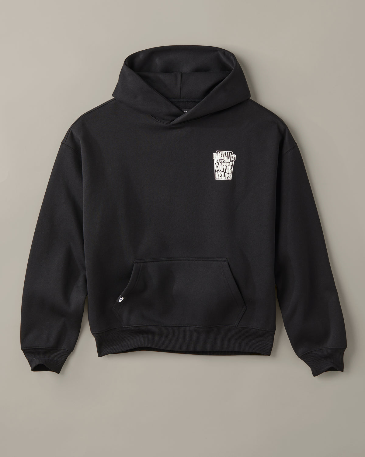 Black unisex pullover hoodie with a small white Barely Alive graphic on the chest. | Chandail à capuchon unisexe noir avec design « Barely Alive » sur le torse. - Image #4