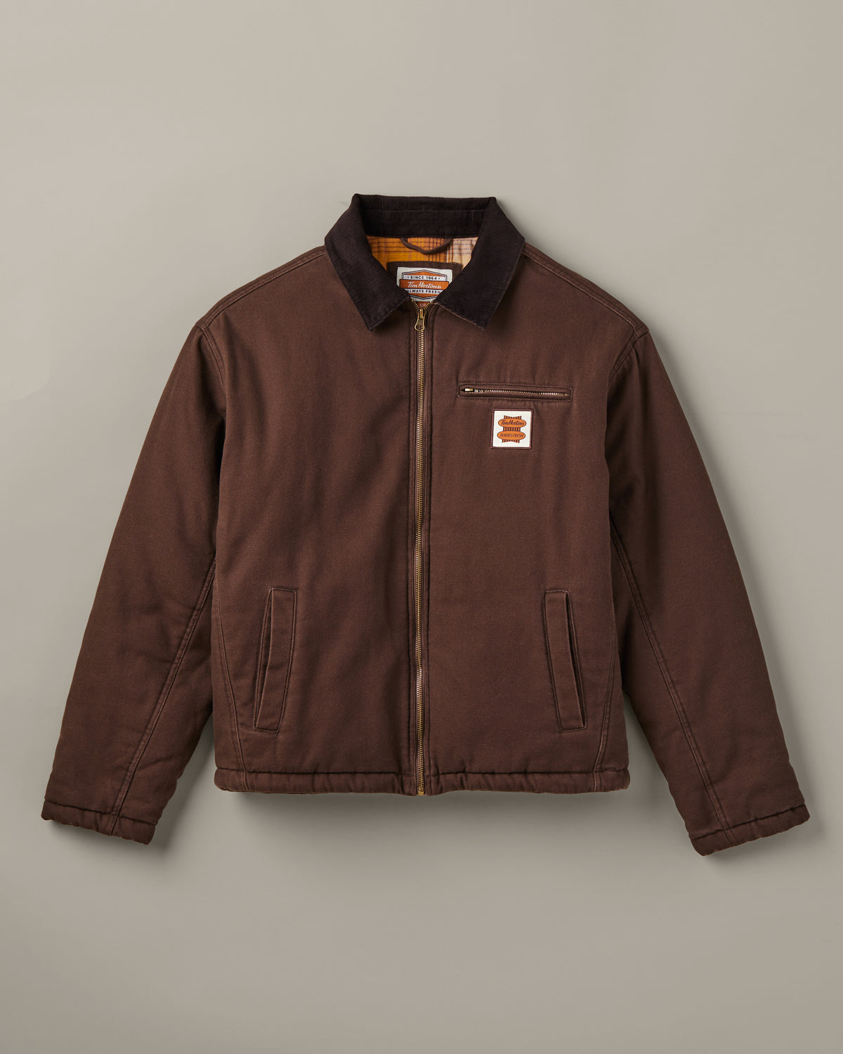 Espresso-brown Tim Hortons workwear jacket with a dark collar, front zipper, zippered chest pocket, side pockets, and retro logo patch. | Veste de travail Tim Hortons brune espresso avec col foncé, fermeture à glissière sur le devant, poche poitrine à fermeture à glissière, poches latérales et écusson à logo rétro. - Image #3