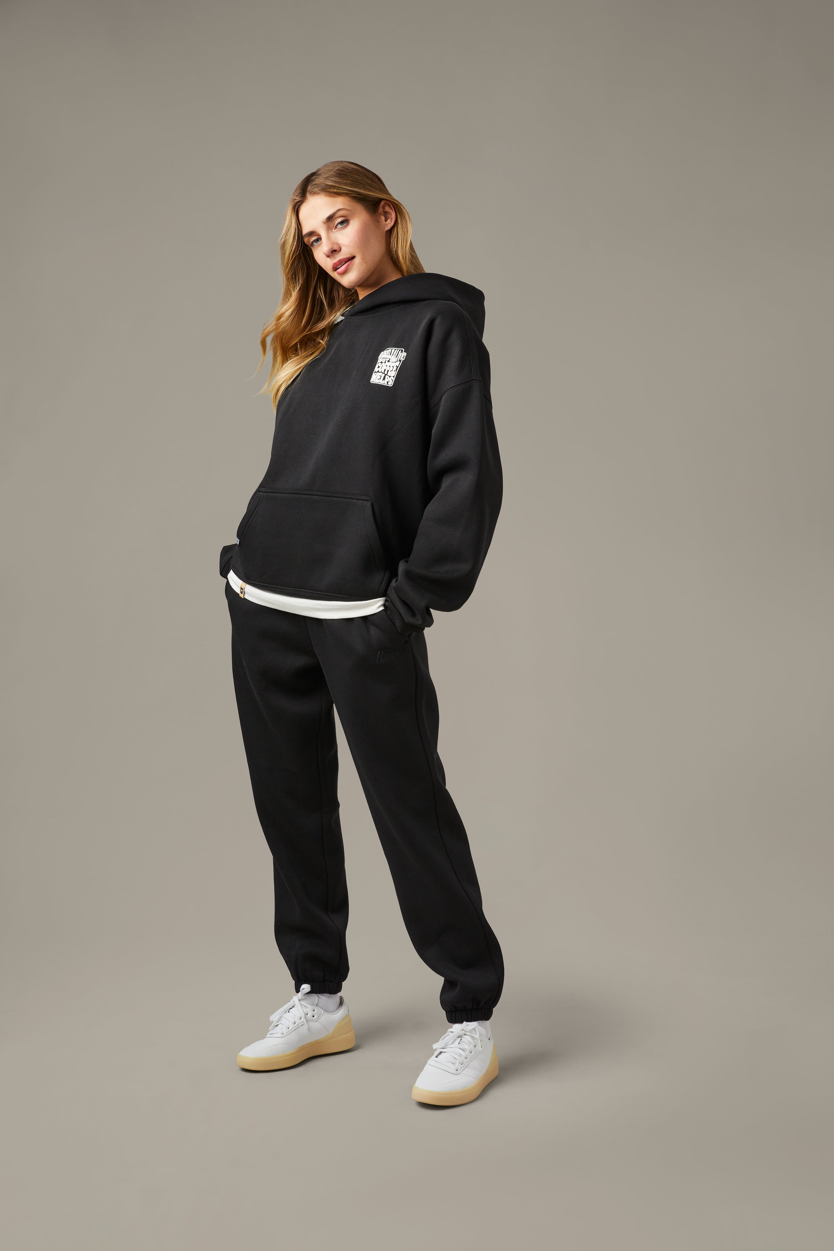 Black unisex pullover hoodie with a small white Barely Alive graphic on the chest. | Chandail à capuchon unisexe noir avec design « Barely Alive » sur le torse. - Image #3