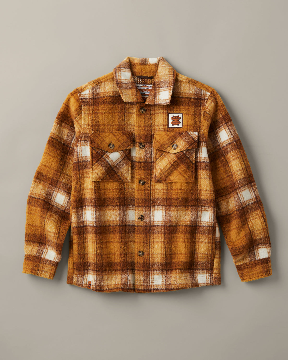 Yellow, brown, and cream plaid Tim Hortons shacket with a button front, two flap chest pockets, and a small logo patch. | Surchemise Tim Hortons à carreaux jaunes, bruns et crème, avec fermeture à bouton sur le devant, deux poches poitrine à rabat et un petit écusson à logo. - Image #3