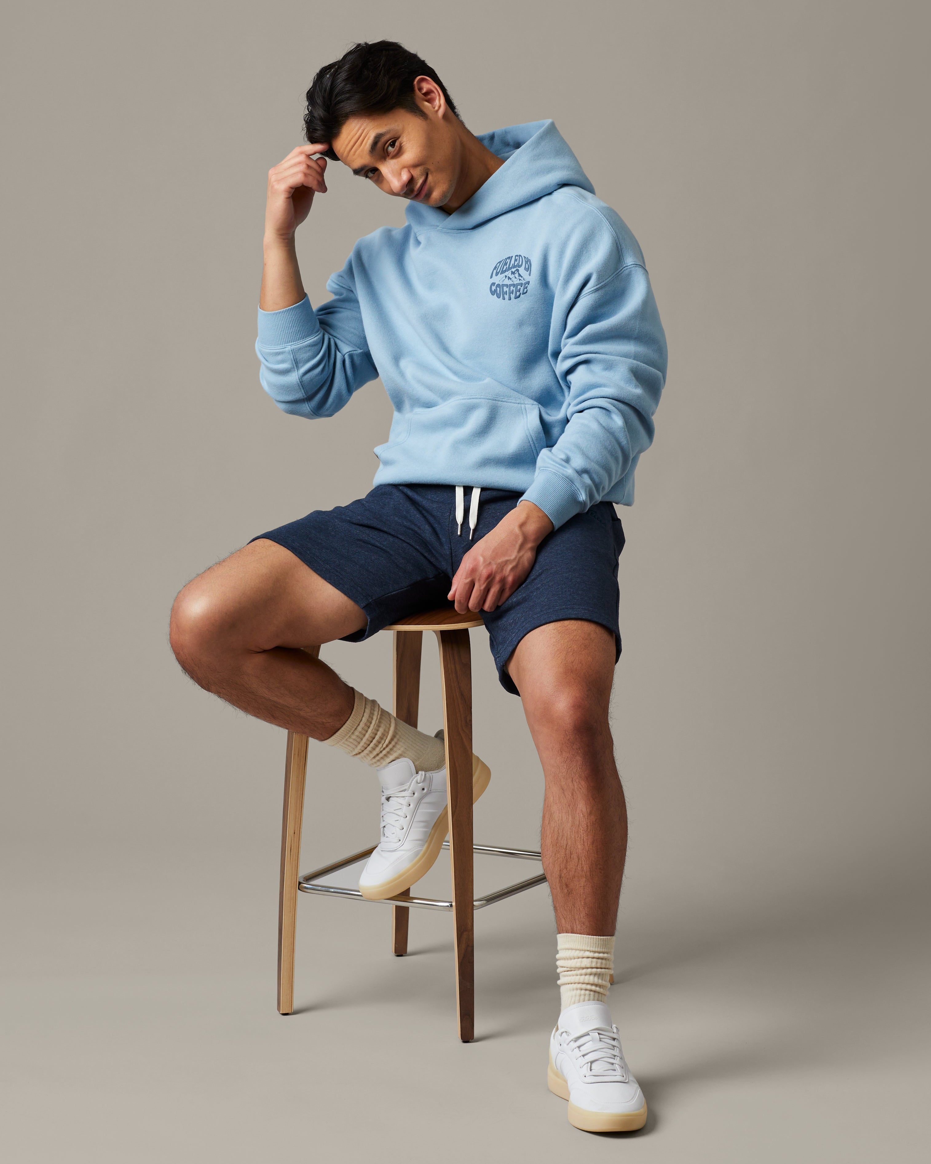 Light blue unisex hoodie featuring Fueled by Coffee graphic | Light blue unisex hoodie featuring Fueled by Coffee graphic. - Image #1