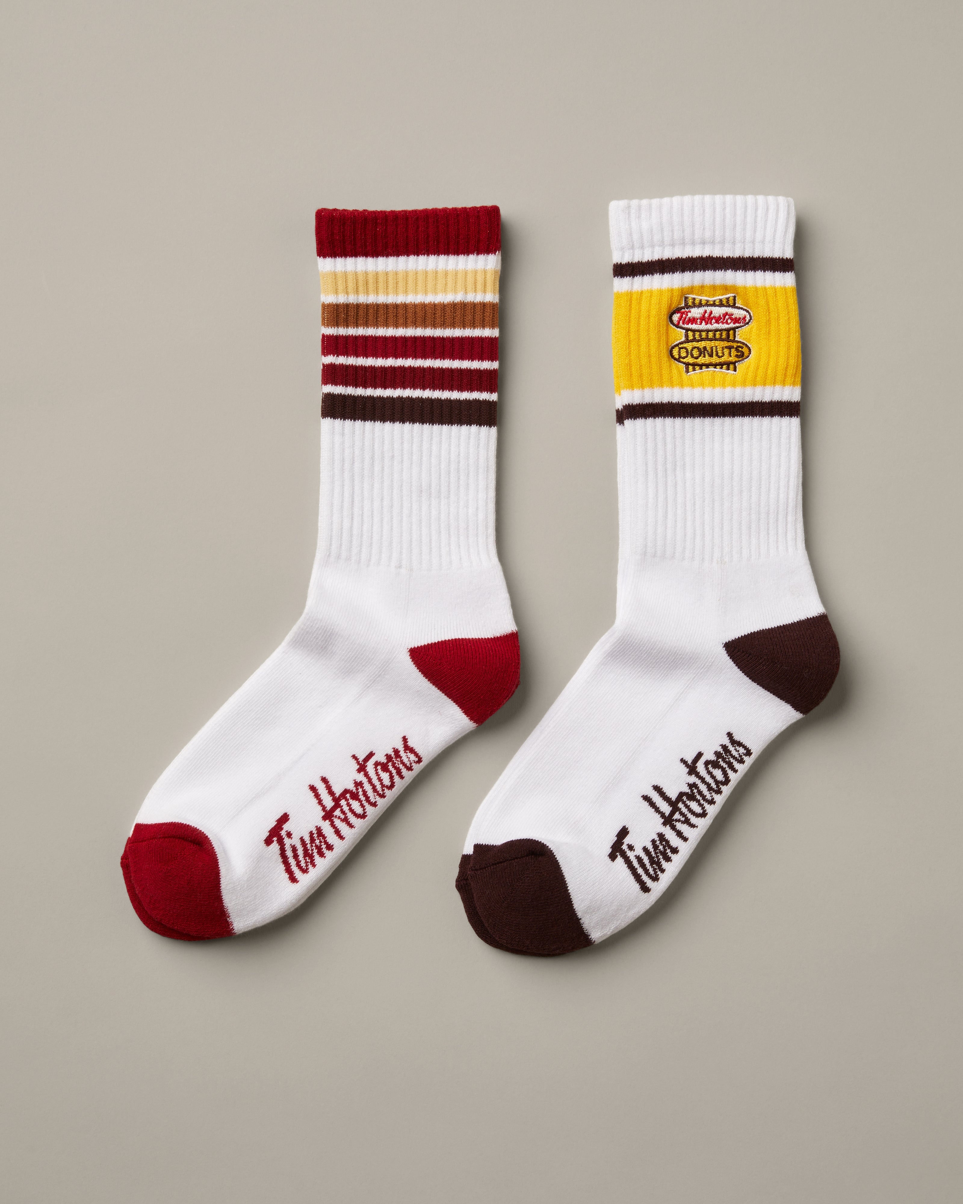 Set of two unisex crew socks featuring retro Tim Hortons designs | Ensemble de deux paires de bas avec designs Tim Hortons rétro.