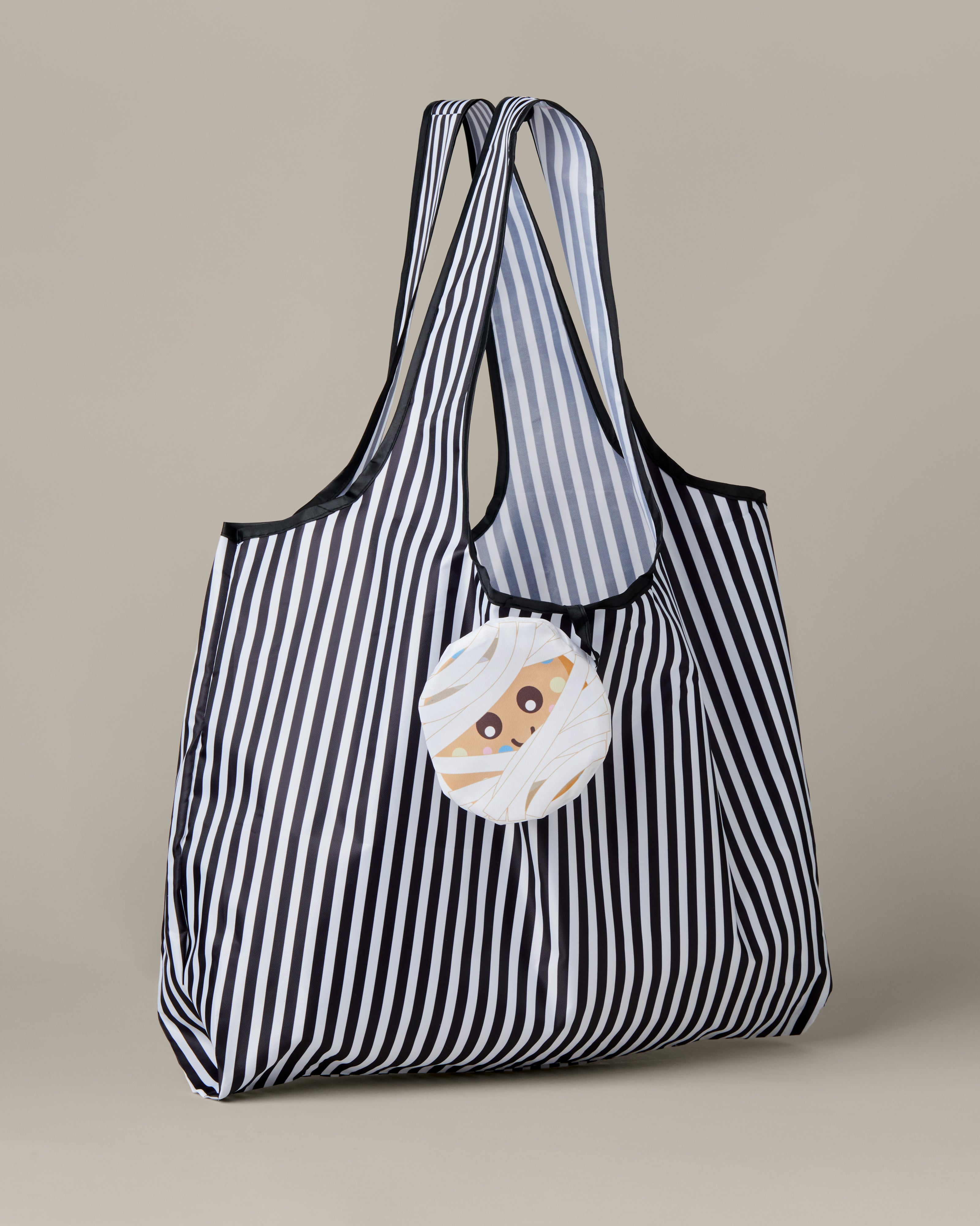 Black-and-white striped packable tote bag with a Timbits® Mummy storage pouch. | Sac réutilisable repliable rayé noir et blanc avec poche de rangement momie TimbitsMD. - Image #4