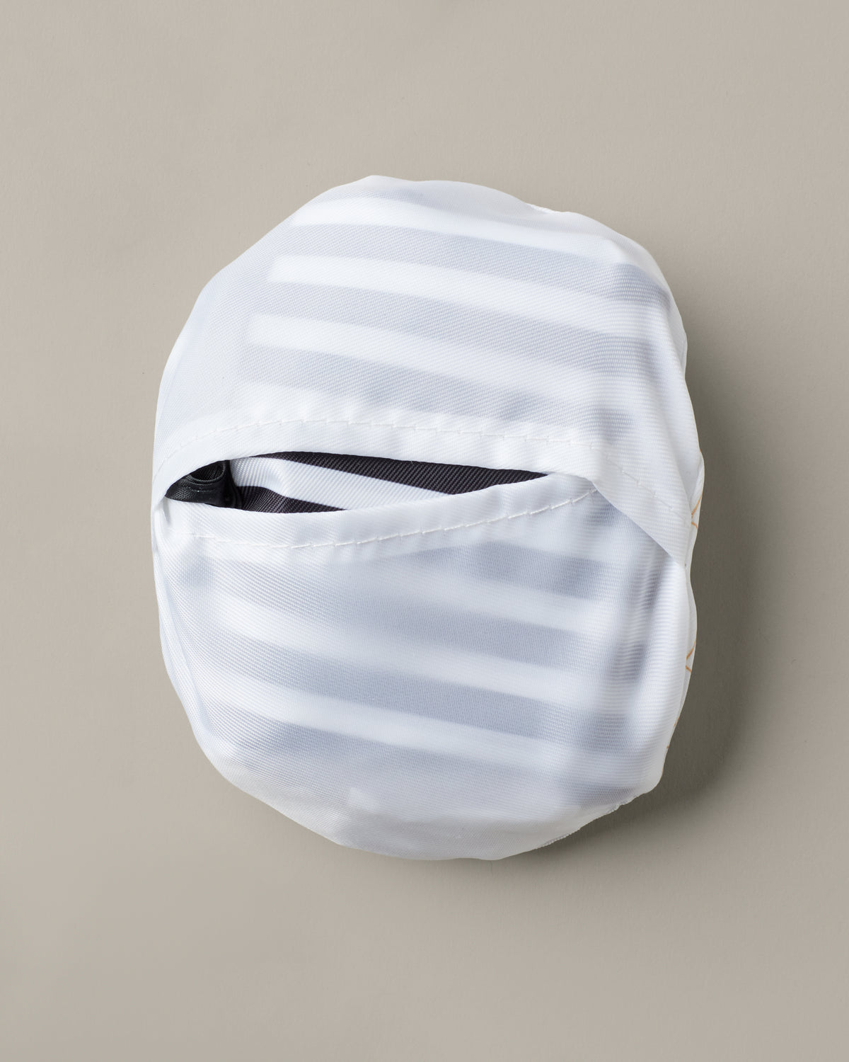 Black-and-white striped packable tote bag with a Timbits® Mummy storage pouch. | Sac réutilisable repliable rayé noir et blanc avec poche de rangement momie TimbitsMD. - Image #6