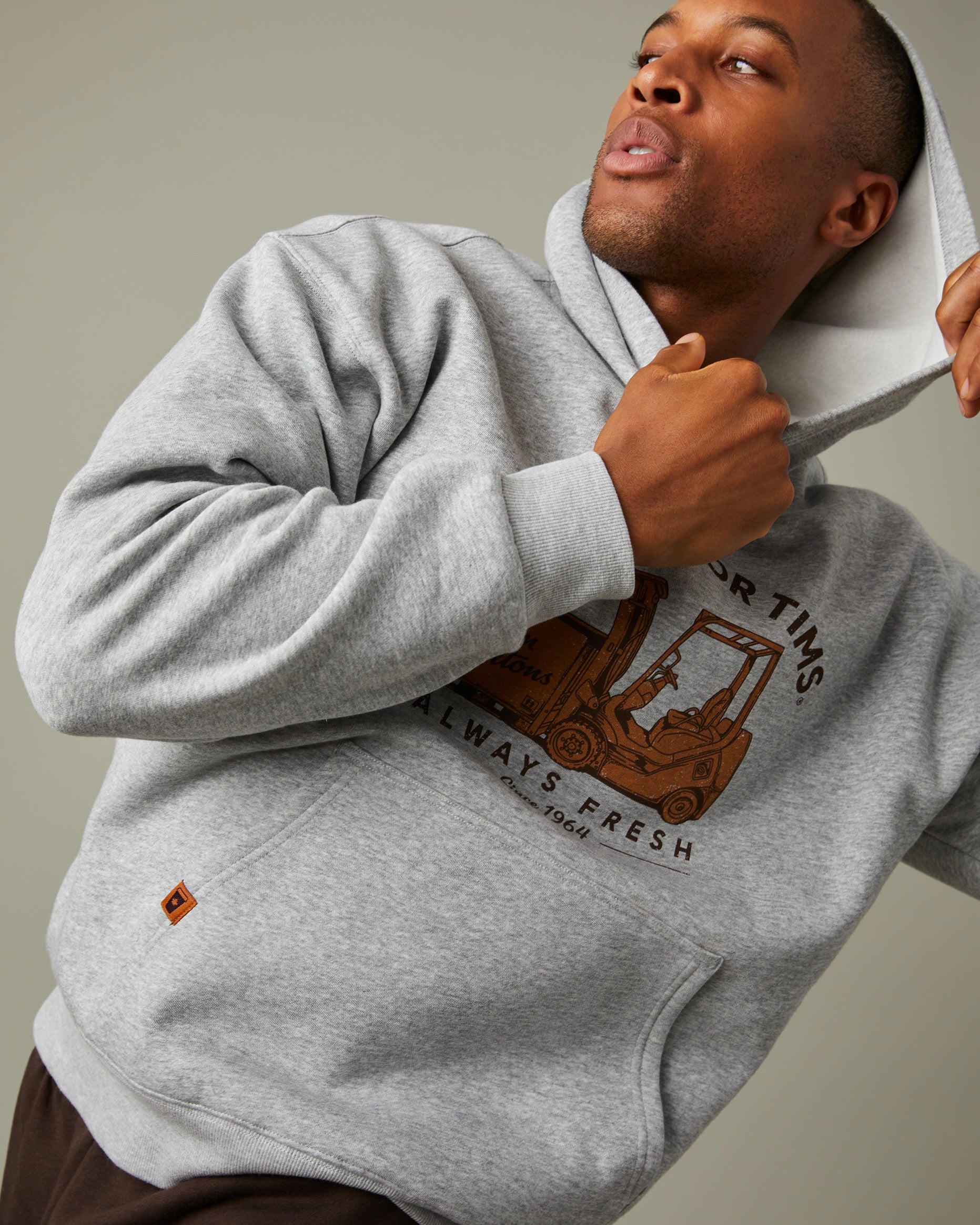 Grey hoodie with “It’s Time for Tims” graphic featuring a forklift carrying Tim Hortons coffee | Chandail à capuchon gris avec un logo « It’s Time for Tims » montrant un chariot élévateur transportant un café Tim Hortons - Image #2